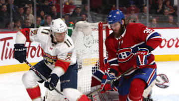 Mar 19, 2018; Montreal, Quebec, CAN; Jonathan Huberdeau (11) and Montreal Canadiens defenseman. Mandatory Credit: Jean-Yves Ahern-USA TODAY Sports