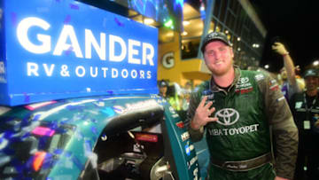 HOMESTEAD, FLORIDA - NOVEMBER 15: Austin Hill, driver of the #16 Chiba Toyopet Toyota, poses with the winner's decal on his car in Victory Lane after winning the NASCAR Gander Outdoors Truck Series Ford EcoBoost 200 at Homestead-Miami Speedway on November 15, 2019 in Homestead, Florida. (Photo by Jared C. Tilton/Getty Images)