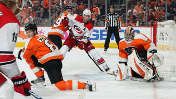 PHILADELPHIA, PA - APRIL 06: Jordan Staal #11 of the Carolina Hurricanes positions himself on a scoring opportunity against Robert Hagg #8, Mark Friedman #59 and Carter Hart #79 of the Philadelphia Flyers on April 6, 2019 at the Wells Fargo Center in Philadelphia, Pennsylvania. (Photo by Len Redkoles/NHLI via Getty Images)