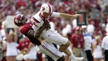 Sep 10, 2016; Tuscaloosa, AL, USA; Alabama Crimson Tide linebacker Tim Williams (56) throws Western Kentucky Hilltoppers quarterback Mike White (14) to the ground and receives a roughing the passer call for the play at Bryant-Denny Stadium. Mandatory Credit: Marvin Gentry-USA TODAY Sports
