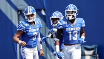 MEMPHIS, TN - SEPTEMBER 7: Brady White #3, Kenneth Gainwell #19 and Kedarian Jones #13 of the Memphis Tigers celebrate after a touchdown against the Southern Jaguars on September 7, 2019 at Liberty Bowl Memorial Stadium in Memphis, Tennessee. Memphis defeated Southern 55-24. (Photo by Joe Murphy/Getty Images)