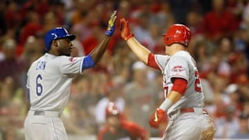 Jul 14, 2015; Cincinnati, OH, USA; American League outfielder Mike Trout (27) of the Los Angeles Angels high fives American League outfielder Lorenzo Cain (6) of the Kansas City Royals after scoring against the National League during the fifth inning of the 2015 MLB All Star Game at Great American Ball Park. Mandatory Credit: Rick Osentoski-USA TODAY Sports
