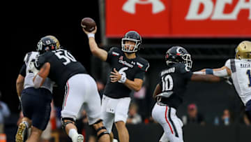Cincinnati Bearcats quarterback Ben Bryant throws a pass against the Navy Midshipmen at Nippert Stadium. USA Today.