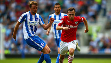 BRIGHTON, ENGLAND - SEPTEMBER 24: Josh Scowen of Barnsley battles for the ball with Dale Stephens of Brighton