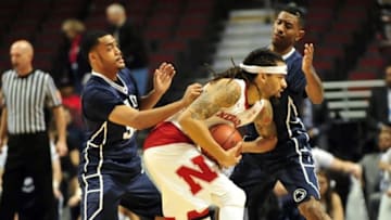 Mar 11, 2015; Chicago, IL, USA; Penn State Nittany Lions guard Shep Garner (left) guard Geno Thorpe (right) defend Nebraska Cornhuskers forward Terran Petteway (center) during the first half in the first round of the Big Ten Conference Tournament at the United Center. Mandatory Credit: David Banks-USA TODAY Sports