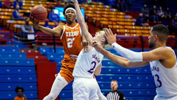 Jan 2, 2021; Lawrence, Kansas, USA; Texas Longhorns forward Kai Jones (22) shoots against Kansas Jayhawks guard Christian Braun (2) during the second half at Allen Fieldhouse. Mandatory Credit: Jay Biggerstaff-USA TODAY Sports