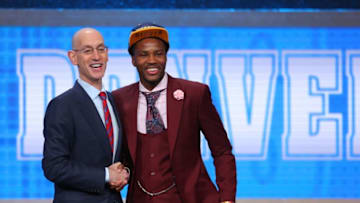 Jun 23, 2016; New York, NY, USA; Malik Beasley (Florida State) greets NBA commissioner Adam Silver after being selected as the number nineteen overall pick to the Denver Nuggets in the first round of the 2016 NBA Draft at Barclays Center. Mandatory Credit: Brad Penner-USA TODAY Sports