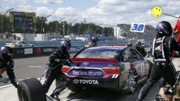Aug 7, 2016; Watkins Glen, NY, USA; Sprint Cup Series driver Denny Hamlin (11) making a pit stop during the Cheez-It 355 at Watkins Glen International. Mandatory Credit: Kevin Hoffman-USA TODAY Sports