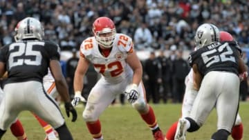 Dec 6, 2015; Oakland, CA, USA; Kansas City Chiefs tackle Eric Fisher (72) defends against Oakland Raiders defensive end Khalil Mack (52) and corneback D.J. Hayden (25) during an NFL football game at O.co Coliseum. The Chiefs defeated the Raiders 34-20. Mandatory Credit: Kirby Lee-USA TODAY Sports