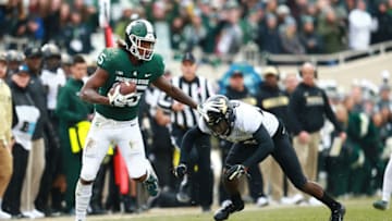 EAST LANSING, MI - OCTOBER 27: Darrell Stewart Jr. #25 of the Michigan State Spartans makes a catch and runs the ball for the first down against the Purdue Boilermakers at Spartan Stadium on October 27, 2018 in East Lansing, Michigan. (Photo by Rey Del Rio/Getty Images)
