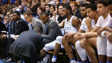 Jan 7, 2017; Durham, NC, USA; Duke Blue Devils forward Amile Jefferson (21) has his right foot checked out by athletic trainer Jose Fonseca during the first half of their game against the Boston College Eagles at Cameron Indoor Stadium. Mandatory Credit: Mark Dolejs-USA TODAY Sports