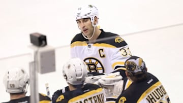 Oct 17, 2016; Winnipeg, Manitoba, CAN; Boston Bruins defenseman Zdeno Chara (33) celebrates with teammates after scoring on Winnipeg Jets goalie Connor Hellebuyck (not pictured) during the second period at MTS Centre. Mandatory Credit: Bruce Fedyck-USA TODAY Sports