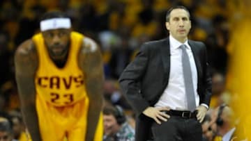 Jan 25, 2015; Cleveland, OH, USA; Cleveland Cavaliers head coach David Blatt (right) reacts beside forward LeBron James (23) against the Oklahoma City Thunder at Quicken Loans Arena. Cleveland won 108-98. Mandatory Credit: David Richard-USA TODAY Sports