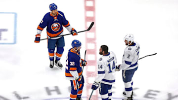 EDMONTON, ALBERTA - SEPTEMBER 13: Matt Martin #17 and Ross Johnston #32 of the New York Islanders exchange words with Pat Maroon #14 and Luke Schenn #2 of the Tampa Bay Lightning during warmups prior to Game Four of the Eastern Conference Final during the 2020 NHL Stanley Cup Playoffs at Rogers Place on September 13, 2020 in Edmonton, Alberta, Canada. (Photo by Bruce Bennett/Getty Images)