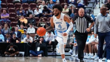 Nov 21, 2021; Uncasville, CT, USA; North Carolina Tarheels guard RJ Davis (4) dribbles the ball up the court against the Tennessee Volunteers during the first half at Mohegan Sun Arena. Mandatory Credit: Gregory Fisher-USA TODAY Sports