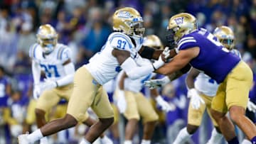 Auburn footballOct 16, 2021; Seattle, Washington, USA; UCLA Bruins defensive lineman Odua Isibor (97) blocks against Washington Huskies linebacker Milton Hopkins Jr. (52) during the third quarter at Alaska Airlines Field at Husky Stadium. Mandatory Credit: Joe Nicholson-USA TODAY Sports