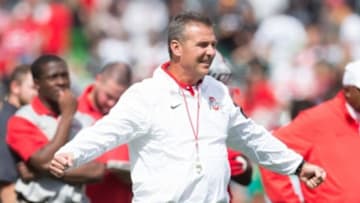 Sep 12, 2015; Columbus, OH, USA; Ohio State Buckeyes head coach Urban Meyer runs his team through drills before the game against the Hawaii Warriors at Ohio Stadium. Ohio State won the game 38-0. Mandatory Credit: Greg Bartram-USA TODAY Sports