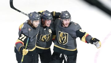 Nate Schmidt #88 of the Vegas Golden Knights is congratulated by teammates William Karlsson #71 and Jonathan Marchessault #81 of the Vegas Golden Knights in the third period against the Dallas Stars in a Western Conference Round Robin game. (Photo by Jeff Vinnick/Getty Images)