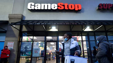 WILKES-BARRE, UNITED STATES - 2020/11/27: A man wearing a face mask leaves Game Stop with the new PlayStation5 game console.Game Stop only had 2 in stock for Black Friday. (Photo by Aimee Dilger/SOPA Images/LightRocket via Getty Images)
