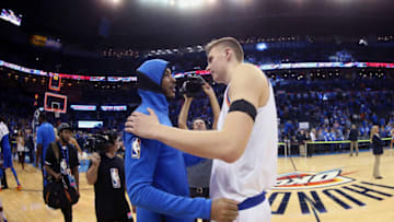 OKLAHOMA CITY, OK- OCTOBER 19: Carmelo Anthony #7 of the Oklahoma City Thunder and Kristaps Porzingis #6 of the New York Knicks hug after the game on October 19, 2017 at Chesapeake Energy Arena in Oklahoma City, Oklahoma. Copyright 2017 NBAE (Photo by Layne Murdoch Sr./NBAE via Getty Images)