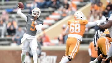 Tennessee quarterback Hendon Hooker (5) throws a pass as Tennessee offensive lineman Cade Mays (68) defends at the Orange & White spring game at Neyland Stadium in Knoxville, Tenn. on Saturday, April 24, 2021.Kns Vols Spring Game