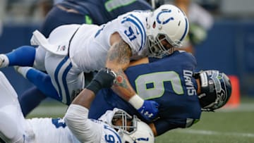 SEATTLE, WA - AUGUST 09: Quarterback Austin Davis #6 of the Seattle Seahawks is tackled by defensive end John Simon #51 and defensive end Denico Autry #95 of the Indianapolis Colts at CenturyLink Field on August 9, 2018 in Seattle, Washington. (Photo by Otto Greule Jr/Getty Images)