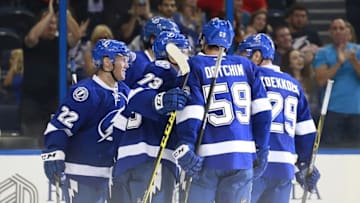 Sep 25, 2015; Tampa, FL, USA; Tampa Bay Lightning right wing Erik Condra (22) is congratulated by teammates after scoring a goal against the Florida Panthers during the second period at Amalie Arena. Mandatory Credit: Kim Klement-USA TODAY Sports