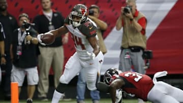 Sep 11, 2016; Atlanta, GA, USA; Tampa Bay Buccaneers running back Charles Sims (34) scores a touchdown reception against Atlanta Falcons defensive back Brian Poole (34) in the second quarter of their game at the Georgia Dome. Mandatory Credit: Jason Getz-USA TODAY Sports