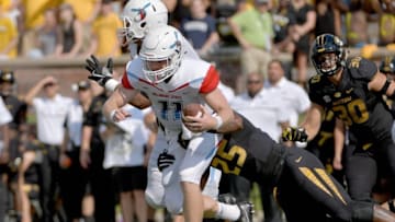 Sep 24, 2016; Columbia, MO, USA; Delaware State Hornets quarterback Daniel Epperson (11) is sacked by Missouri Tigers linebacker Donavin Newsom (25) during the first half at Faurot Field. Mandatory Credit: Denny Medley-USA TODAY Sports