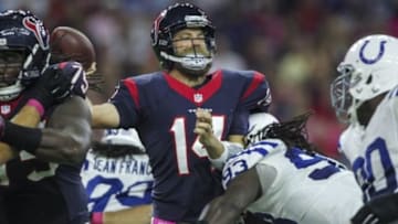 Oct 9, 2014; Houston, TX, USA; Houston Texans quarterback Ryan Fitzpatrick (14) attempts a pass during the first quarter as Indianapolis Colts outside linebacker Erik Walden (93) applies pressure at NRG Stadium. Mandatory Credit: Troy Taormina-USA TODAY Sports