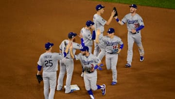 WASHINGTON, DC - OCTOBER 06: The Los Angeles Dodgers celebrate after the final out of Game 3 of the NLDS to defeat the Washington Nationals 10-4 at Nationals Park on October 6, 2019 in Washington, DC. (Photo by Patrick McDermott/Getty Images)