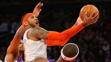 Feb 12, 2014; New York, NY, USA; New York Knicks small forward Carmelo Anthony (7) drives to the basket during the second half against the Sacramento Kings at Madison Square Garden. Sacramento Kings defeat the New York Knicks 106-101 in OT. Mandatory Credit: Jim O'Connor-USA TODAY Sports