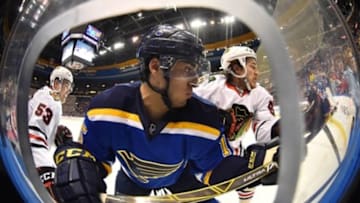 Mar 9, 2016; St. Louis, MO, USA; Chicago Blackhawks center Andrew Shaw (65) checks St. Louis Blues center Robby Fabbri (15) during the second period at Scottrade Center. Mandatory Credit: Jasen Vinlove-USA TODAY Sports