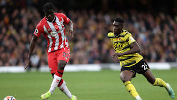 WATFORD, ENGLAND - OCTOBER 30: Mohammed Salisu of Southampton holds off Ismaila Sarr of Watford during the Premier League match between Watford and Southampton at Vicarage Road on October 30, 2021 in Watford, England. (Photo by Julian Finney/Getty Images)