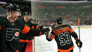 PHILADELPHIA, PA - NOVEMBER 29: Shayne Gostisbehere #53 of the Philadelphia Flyers celebrates his first period goal with teammates Michael Raffl #12 and James van Riemsdyk #25 against the Detroit Red Wings on November 29, 2019 at the Wells Fargo Center in Philadelphia, Pennsylvania. (Photo by Len Redkoles/NHLI via Getty Images)
