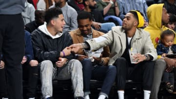 CHARLOTTE, NC - FEBRUARY 15: Devin Booker #1 of the Phoenix Suns and D'Angelo Russell #1 of the Brooklyn Nets attend the 2019 Mtn Dew ICE Rising Stars Game on February 15, 2019 at the Spectrum Center in Charlotte, North Carolina. NOTE TO USER: User expressly acknowledges and agrees that, by downloading and/or using this photograph, user is consenting to the terms and conditions of the Getty Images License Agreement. Mandatory Copyright Notice: Copyright 2019 NBAE (Photo by Andrew D. Bernstein/NBAE via Getty Images)