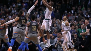BOSTON - MARCH 20: Boston Celtics' Marcus Morris shoots a three-point shot with 1.2 seconds left in the game that gave Boston a 100-99 victory. The Boston Celtics host the Oklahoma City Thunder in a regular season NBA basketball game at TD Garden in Boston on March 20, 2018. (Photo by Jim Davis/The Boston Globe via Getty Images)