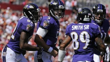 Oct 12, 2014; Tampa, FL, USA; Baltimore Ravens quarterback Joe Flacco (5) celebrates a touchdown with wide receivers Torrey Smith (82) and Steve Smith (89) against the Tampa Bay Buccaneers at Raymond James Stadium. Mandatory Credit: David Manning-USA TODAY Sports