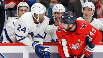 Feb 28, 2022; Washington, District of Columbia, USA; Toronto Maple Leafs right wing Wayne Simmonds (24) talks with Washington Capitals right wing Tom Wilson (43) from the bench in the third period at Capital One Arena. Mandatory Credit: Geoff Burke-USA TODAY Sports
