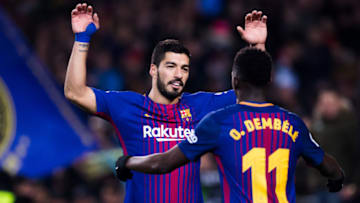 BARCELONA, SPAIN - FEBRUARY 24: Luis Suarez of FC Barcelona celebrates with his teammate Ousmane Dembele after scoring his team's sixth goal during the La Liga match between Barcelona and Girona at Camp Nou on February 24, 2018 in Barcelona, Spain. (Photo by Alex Caparros/Getty Images)