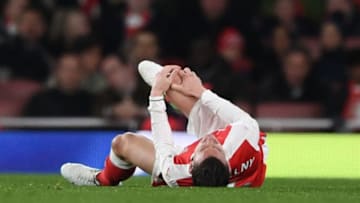 LONDON, ENGLAND - APRIL 26: Laurent Koscielny of Arsenal looks dejected following an injury during the Premier League match between Arsenal and Leicester City at the Emirates Stadium on April 26, 2017 in London, England. (Photo by Shaun Botterill/Getty Images)