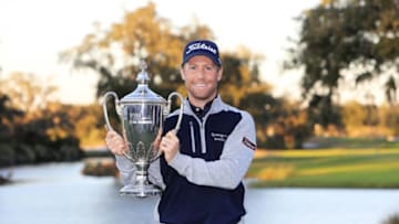 ST SIMONS ISLAND, GEORGIA - NOVEMBER 24: Tyler Duncan of the United States celebrates with the winner's trophy after the final round of the RSM Classic on the Seaside course at Sea Island Golf Club on November 24, 2019 in St Simons Island, Georgia. (Photo by Streeter Lecka/Getty Images)