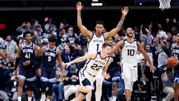 INDIANAPOLIS, INDIANA - FEBRUARY 05: Sean McDermott #22, Jordan Tucker #1 and Bryce Nze #10 of the Butler Bulldogs celebrate after their win over the Villanova Wildcats at Hinkle Fieldhouse on February 05, 2020 in Indianapolis, Indiana. The Bulldogs defeated the Wildcats 79-76. (Photo by Justin Casterline/Getty Images)