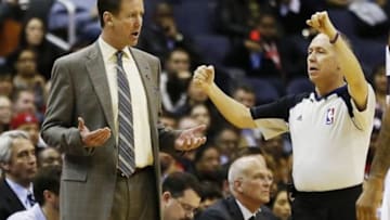 Feb 3, 2014; Washington, DC, USA; Portland Trail Blazers head coach Terry Stotts (L) argues a call with referee Jason Phillips (R) against the Washington Wizards in the fourth quarter at Verizon Center. The Wizards won 100-90. Mandatory Credit: Geoff Burke-USA TODAY Sports