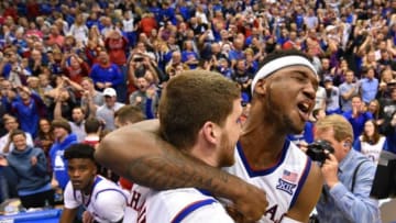 Kansas Jayhawks forward Carlton Bragg Jr. (15) celebrates with guard Sviatoslav Mykhailiuk (10) - Credit: Denny Medley-USA TODAY Sports