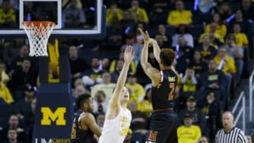Jan 12, 2016; Ann Arbor, MI, USA; Maryland Terrapins guard Melo Trimble (2) shoots the ball over Michigan Wolverines forward Mark Donnal (34) in the first half at Crisler Center. Mandatory Credit: Rick Osentoski-USA TODAY Sports