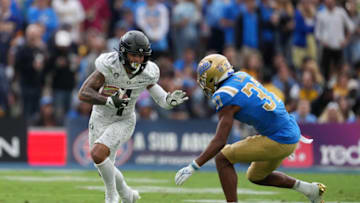 Oct 23, 2021; Pasadena, California, USA; Oregon Ducks wide receiver Mycah Pittman (4) is defended by UCLA Bruins defensive back Quentin Lake (37) in the second half at Rose Bowl. Oregon defeated UCLA 34-31. Mandatory Credit: Kirby Lee-USA TODAY Sports