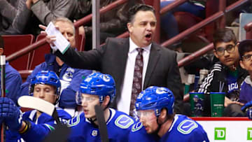 VANCOUVER, BC - MARCH 26: Head coach Travis Green of the Vancouver Canucks looks on from the bench during their NHL game against the Anaheim Ducks at Rogers Arena March 26, 2019 in Vancouver, British Columbia, Canada. (Photo by Jeff Vinnick/NHLI via Getty Images)"n