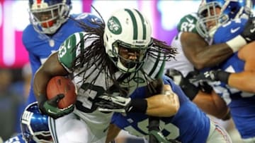 Aug 24, 2013; East Rutherford, NJ, USA; New York Jets running back Chris Ivory (33) runs the ball against the New York Giants during the third quarter of a preseason game at MetLife Stadium. Mandatory Credit: Brad Penner-USA TODAY Sports