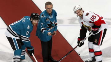 SAN JOSE, CA - JANUARY 18: Joe Pavelski #8 of the San Jose Sharks receives the game puck from Sharks alumni Igor Larionov, as Larionov is honored in tonight alumni night against Erik Karlsson #65 of the Ottawa Senators during a NHL game at the SAP Center at San Jose on January 18, 2016 in San Jose, California. (Photo by Don Smith/NHLI via Getty Images)